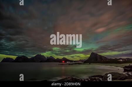 Northern lights brewing, Flakstad, Lofoten, Nordland, Norway Stock Photo