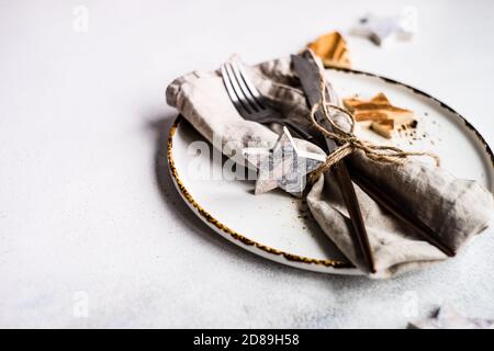 Rustic Christmas place setting on a table Stock Photo