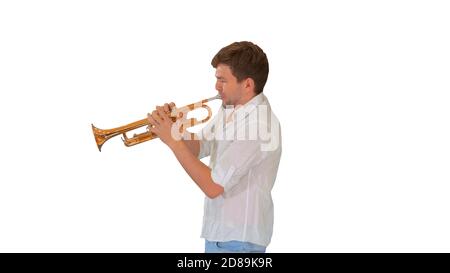 Young musician playing the trumpet on white background. Stock Photo