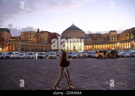 All taxi drivers from Naples gathered in Piazza del Plebiscito to report the difficulties of their profession due to the continuing restrictive. Stock Photo