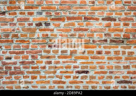 Close-up photo of an old brick wall, texture with copy space. Good pattern for design. Stock Photo