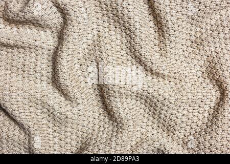 Beige knitting texture background, warm blanket. Good pattern for design. Stock Photo