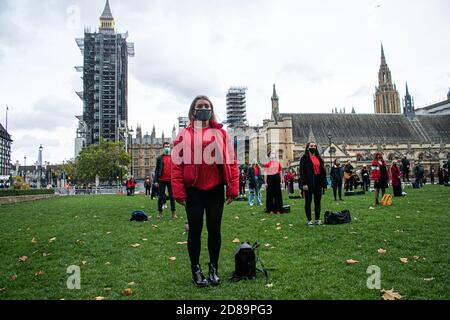 WESTMINSTER LONDON,UK  28 October 2020. Singers and musicians  attend Survival in the Square in a series of creative activations  to highlight that the live events and entertainment sector urgently needs support from national and local governments to survive the Covid-19 crisis and to help the industry back to work while providing support until it can fully return to work. Credit: amer ghazzal/Alamy Live News Stock Photo