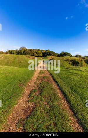 The defensive ramparts and ditches of Badbury Rings Iron Age Hill Fort in Dorset, England Stock Photo