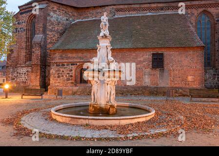 Osterburg, Germany. 13th Oct, 2020. View of the Osterburg Neptune Fountain. It has been standing in front of the St. Nikolai Church for more than seven decades and is one of the city's landmarks. However, Neptune the Trident is missing. Thieves had stolen it in 2016. Since then, Neptune without the trident has been enthroned above the Little Market Square. Credit: Stephan Schulz/dpa-Zentralbild/ZB/dpa/Alamy Live News Stock Photo