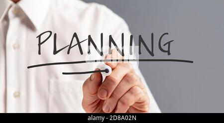 Unrecognizable man writing word planning on invisible board, creative collage Stock Photo