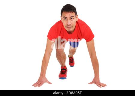 Portrait of mature asian male runner in sportswear taking his position on starting line Stock Photo