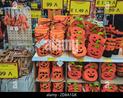 Halloween supermarket products on shelf. Festive decorations including pumpkin mock-ups, on display for sale inside shop gallery in Thessaloniki, Greece. Stock Photo