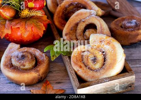 fresh baked cinnamon rolls on wood table Stock Photo