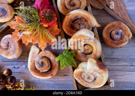 fresh baked cinnamon rolls on wood table Stock Photo