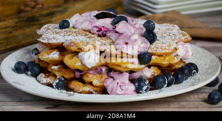 Waffle stack with blueberry cream on a plate Stock Photo