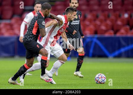 Georginio Wijnaldum of Liverpool FC, Dusan Tadic of Ajax during the UEFA Champions League, Group Stage, Group D football match between Ajax and Live C Stock Photo