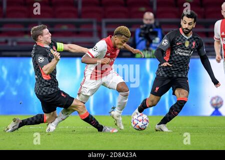 James Milner of Liverpool FC, David Neres of Ajax, Mohamed Salah of Liverpool FC during the UEFA Champions League, Group Stage, Group D football mat C Stock Photo