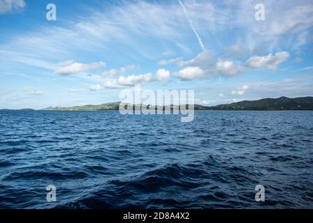 View from the flowing Caribbean Sea into the rolling, green landscape of St. Croix in the US Virgin Islands Stock Photo