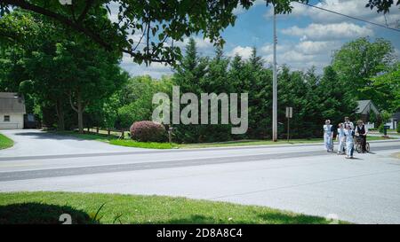 Gordonville, Pennsylvania, June 2020 - Group of Amish Teenagers Walking along road in their Sunday Cloths Stock Photo