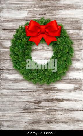 Christmas wreath with red ribbon bow on wooden background Stock Photo