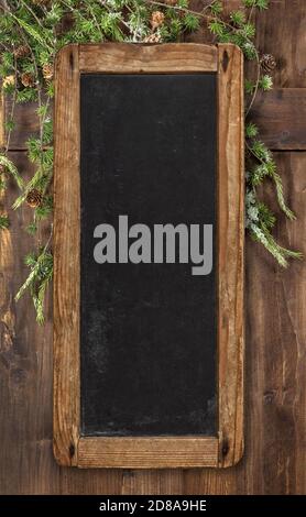 Vintage chalkboard sign with Christmas tree branches decoration Stock Photo