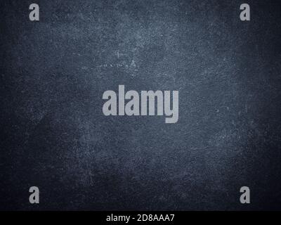 Old Scratched and Chapped Painted Dark Blue and Black Wall. Abstract Painted Dark Blue Wall Background Stock Photo