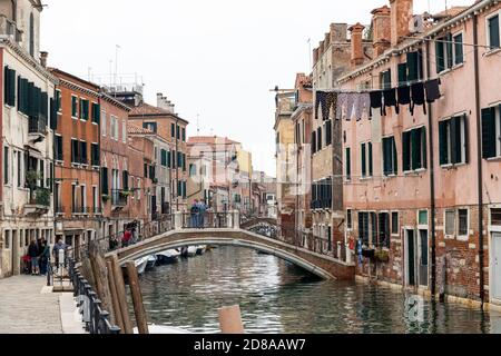 Washing hanging out to dry over the canal in Rio di Sant Anna, Castello region of Venice, Italy 2020 Stock Photo