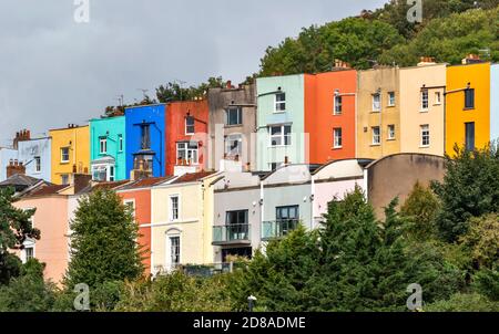 BRISTOL CITY ENGLAND ROWS OF COLOURED HOUSES SURROUNDED BY TREES ON THE HILL Stock Photo