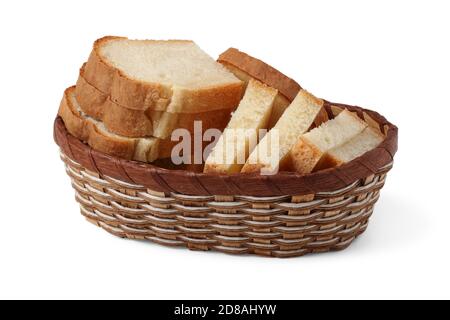 Sliced pieces of wheat bread in a wicker bread basket isolated on white background Stock Photo