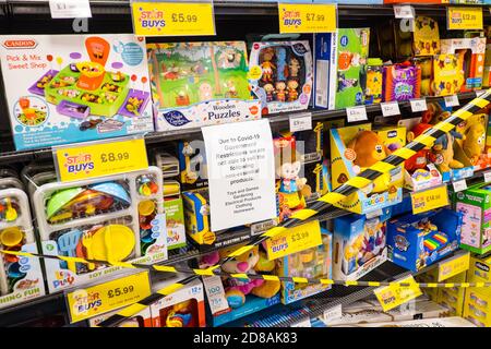 Supermarket,here,Home Bargains,shop,shops,stores,retail,outlet,supermarket,store,not,allowed,to,sell,various,non essential,items,including,Halloween,goods,Christmas,goods,frying pans,toys,due,to,Covid 19,restrictions,during,17 day, firebreak,circuit break,sign,signage,in,shop,business,in,Aberystwyth,Aberystwyth Town,town,town centre, town centre,Cardigan Bay,coast,coastal,student,student town,Wales,Mid Wales,West Wales,Welsh,Europe, Firebreak,circuit break,lockdown,imposed,by,devolved,WAG,Welsh Assembly Government,Welsh Government,Halloween is cancelled, Stock Photo