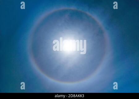 Fantastic Beautiful Sun Halo Phenomenon in the sky. Rainbow Ring around Sun in Summer Stock Photo