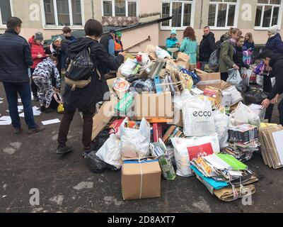 ST. PETERSBURG, RUSSIA-CIRCA MAY, 2019: Pupils of primary school and students of secondary school bring wastepaper for recycling. Scrap paper collecti Stock Photo