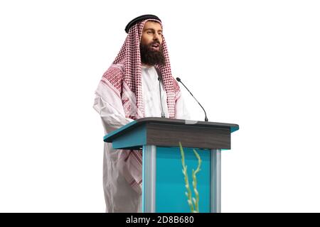 Arab man speaker giving a speech on a pedestal isolated on white background Stock Photo