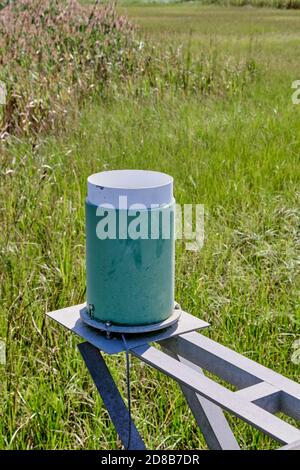 Automated weather and ecological data center rain collection unit, St. Jones Reserve, Dover, DE. Stock Photo