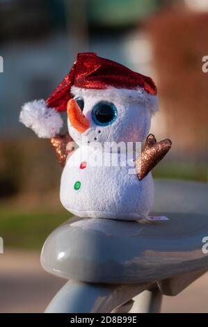 little snowman on soft snow on blue background Stock Photo - Alamy