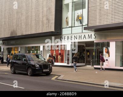 Debenhams Department Store on Oxford Street with a black taxi outside. London Stock Photo