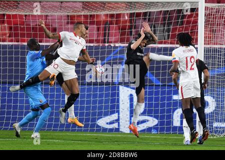 SEVILLE, SPAIN - OCTOBER 28: Diego Carlos and Jules Kounde of FC Sevilla and Alfred Gomis and Jonas Martin of Stade Rennais during the UEFA Champions League Group E stage match between FC Sevilla and Stade Rennais at Estadio Ramon Sanchez-Pizjuan on October 28, 2020 in Seville, Spain. (Photo by Juan Jose Ubeda/ MB Media). Stock Photo
