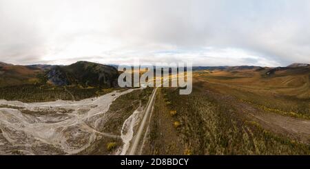 Panoramic View of Scenic Road alongside River Bed Stock Photo