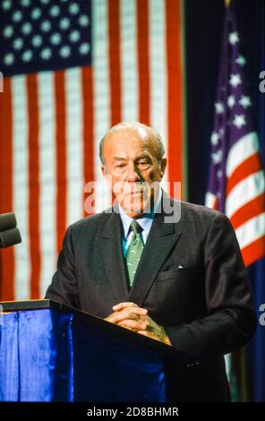 United States Secretary of State George P. Shultz answers reporter's questions in New York, New York following the meeting between United States President Ronald Reagan, US President-elect George H.W. Bush and Chairman of the Presidium of the Supreme Soviet of the USSR Mikhail Gorbachev on December 7, 1988.Credit: Arnie Sachs/CNP | usage worldwide Stock Photo