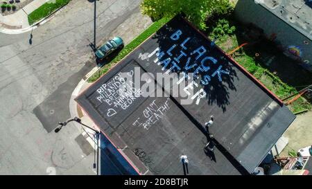 Minneapolis, MN - May 30, 2020: Aerial view of a Black Lives Matter rooftop mural at the aftermath scene of the George Floyd Black Lives Matter protest and riots on May 30, 2020 in Minneapolis, Minnesota. Credit: Jake Handegard//MediaPunch Stock Photo