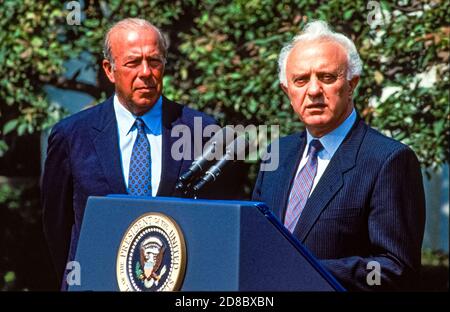 United Stares Secretary of State George P. Shultz, left, listens as Soviet Foreign Minister Edouard Shevardnaze makes remarks after meeting US President Ronald Reagan at the White House in Washington, DC on September 15, 1987.Credit: Ron Sachs / CNP / MediaPunch Stock Photo