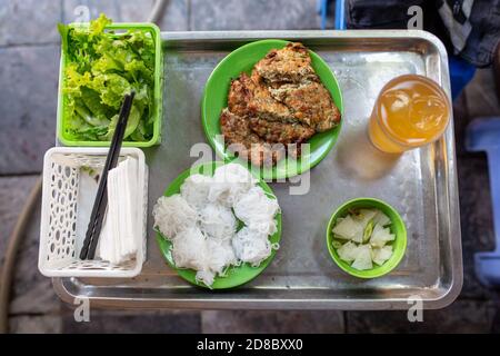 Hanoi, Vietnam. 23rd Oct, 2020. The worm omelette is usually served with rice noodles, a sweet and sour fish sauce and a glass of iced tea. On Hang Chieu Street in the Old Quarter of Hanoi, which is also popular with tourists, the egg dish called 'Cha Ruoi' is sold as street food. (to dpa 'Worm omelette' - Vietnam's slipperiest treat') Credit: Chris Humphrey/dpa/Alamy Live News Stock Photo