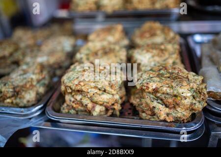 Hanoi, Vietnam. 23rd Oct, 2020. Stacked worm omelets are ready for sale. On Hang Chieu Street in the Old Quarter of Hanoi, which is also popular with tourists, the egg dish called 'Cha Ruoi' is sold as street food. (to dpa 'Worm omelette' - Vietnam's slipperiest treat') Credit: Chris Humphrey/dpa/Alamy Live News Stock Photo