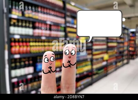 Two fingers are decorated as two person. They are discussing about Stock Photo