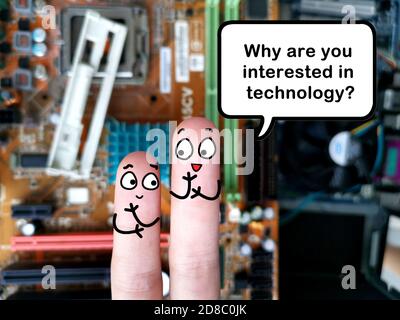 Two fingers are decorated as two person. They are discussing about technology. Stock Photo