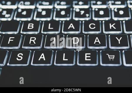 E-Commerce during seasonal sales. Discounts in the online store. The concept of online shopping. Black Friday key on keyboard Stock Photo