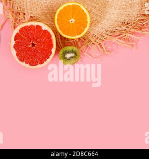 Half a fresh papaya and a straw hat on a pink background Stock Photo ...