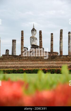 The scenery of Wat Mahathat temple on a cloudy day in the rainy season at Sukhothai province, Thailand. Stock Photo