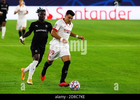 Marcos Acuna of Sevilla and Faitou Maouassa of Stade Rennais during the UEFA Champions League, Group Stage, Group E football match between Sevilla F C Stock Photo