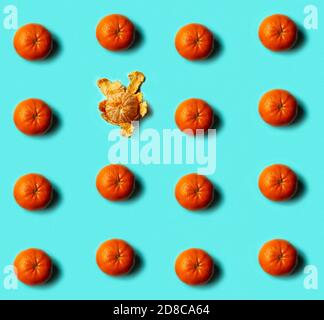 Seamless pattern of mandarin on blue background. Flat lay, top view. Stock Photo