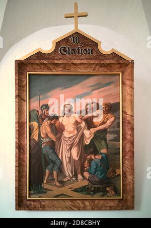 Stations of the Cross by an unknown artist in the handling of the Catholic pilgrimage church to the Holy Trinity in Kappl, Waldsassen, Tirschenreuth County, Upper Palatinate, Bavaria, Germany. 10 Station - Jesus is robbed of his clothes  /  Kreuzwegstationen eines unbekannten Künstlers im Umgang der katholischen Wallfahrtskirche zur Heiligsten Dreifaltigkeit in Kappl, Waldsassen, Landkreis Tirschenreuth, Oberpfalz, Bayern, Deutschland. 10 Station - Jesus wird seiner Kleider beraubt Stock Photo