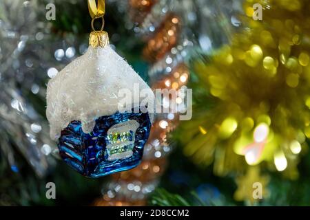 Little Santa stands next to an Armenian wooden Christmas tree toy. There is  a small toy deer near the tree. in miniature. Christmas decorations Stock  Photo - Alamy