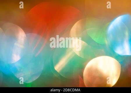 Colorful holiday decorations, abstract blurry bokeh background effect Stock Photo