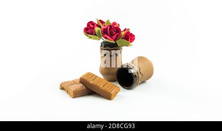 Still life with vase and pottery, lean set with iris on a white isolated background Stock Photo